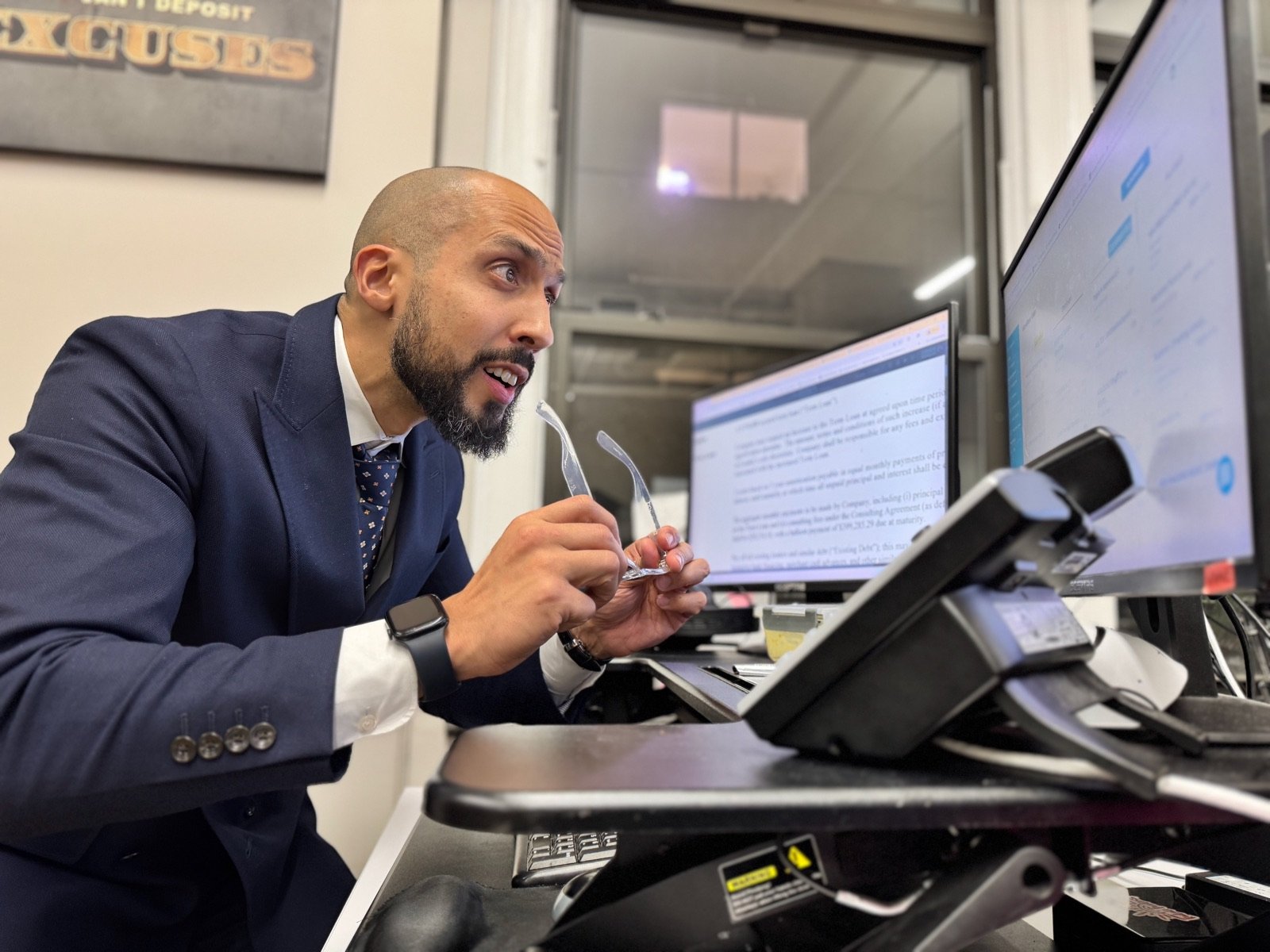 Vinnie Rodriguez reviewing a term sheet at his desk