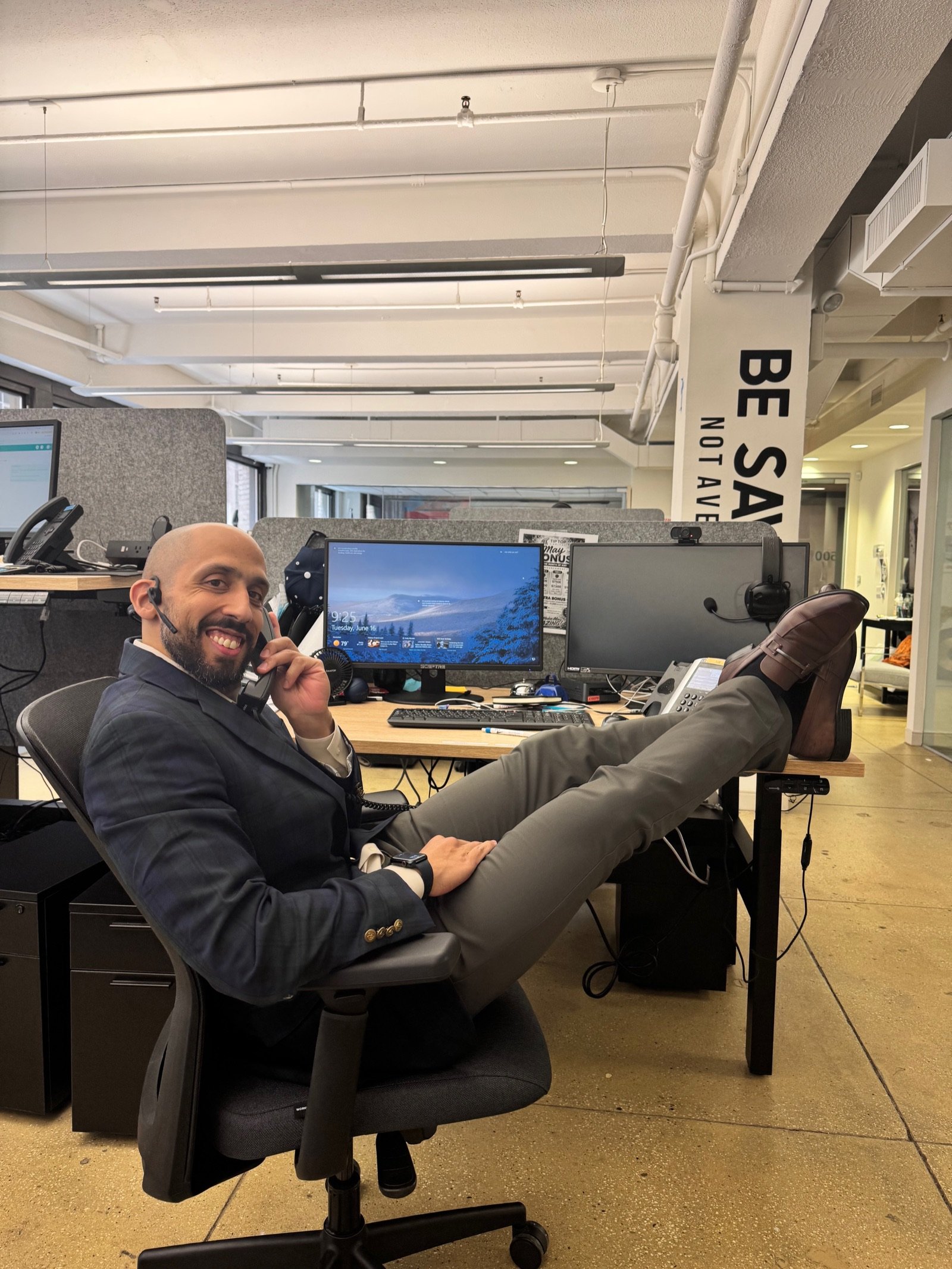 Vinnie Rodriguez on a call at the office